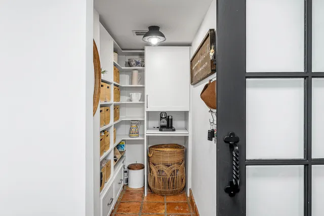 a dining room with furniture window and wooden floor