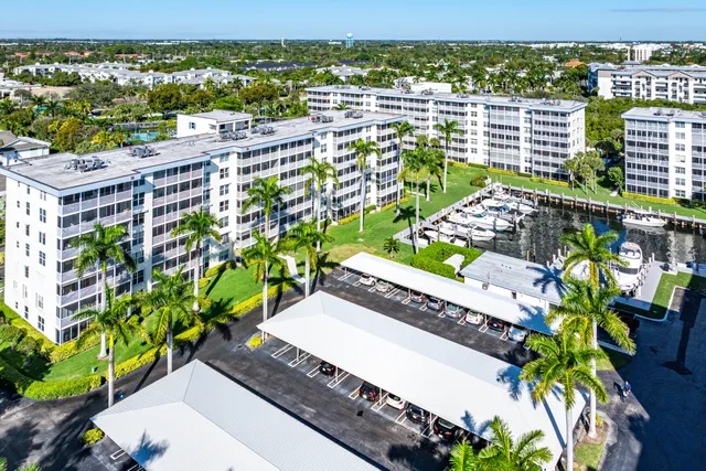 a view of swimming pool with outdoor seating yard and lake view