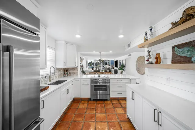 a view of a refrigerator in kitchen and a refrigerator