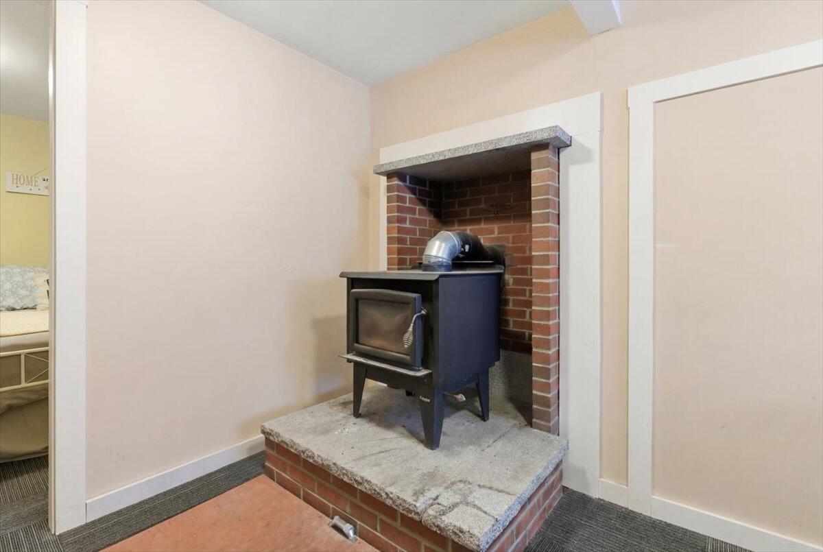 14 McNeil Road Sumner, ME 04292 - Photo 36 of 54 Wood stove in bonus room