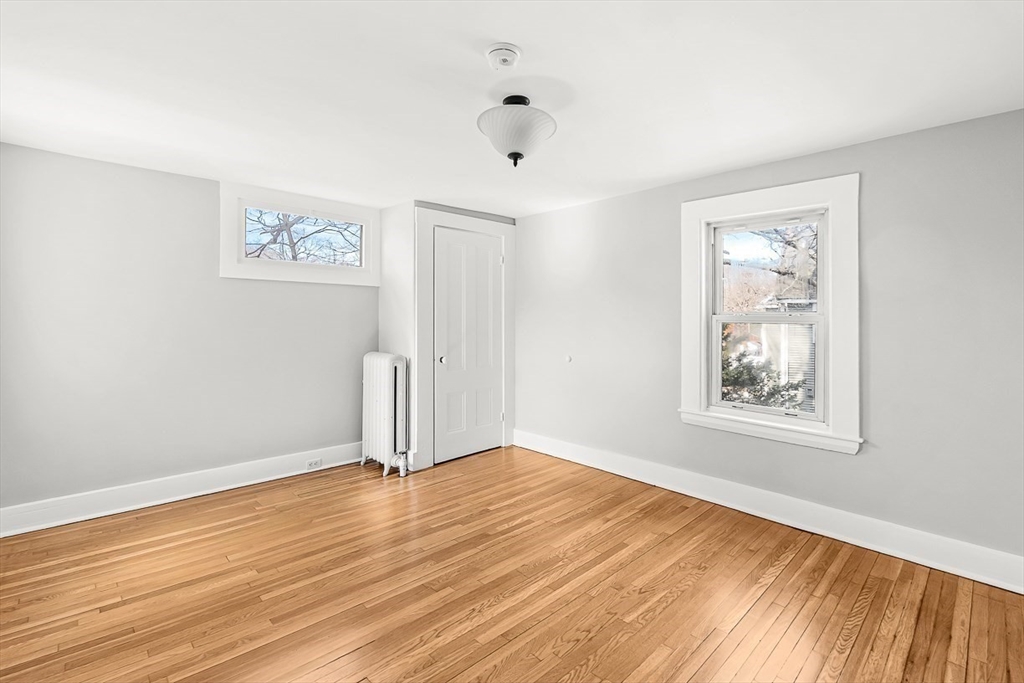 53 Lake Street Winchester, MA 01890 - Photo 21 of 36 a view of empty room with wooden floor and fan