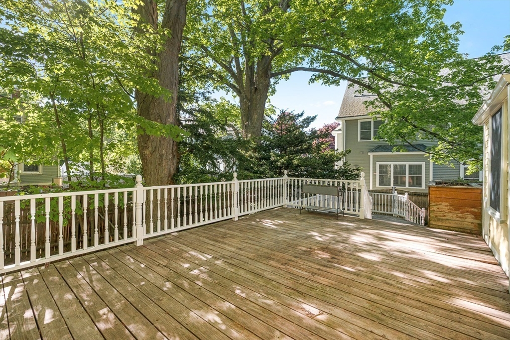 53 Lake Street Winchester, MA 01890 - Photo 26 of 36 a view of a chair and trees in the front of the house