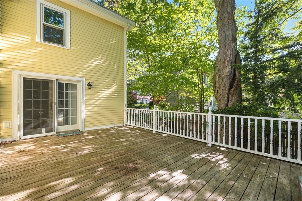 53 Lake Street Winchester, MA 01890 - Photo 32 of 36 a view of backyard with deck and wooden floor