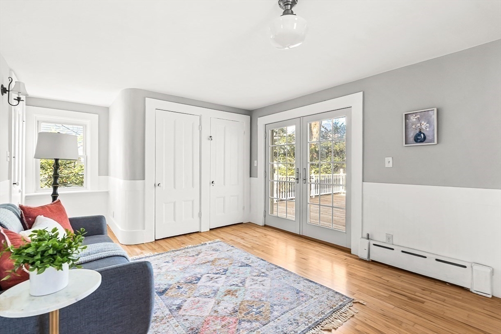 53 Lake Street Winchester, MA 01890 - Photo 6 of 36 a view of an entryway with wooden floor and a rug