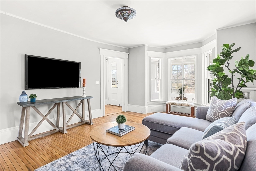 53 Lake Street Winchester, MA 01890 - Photo 7 of 36 a living room with furniture and a flat screen tv