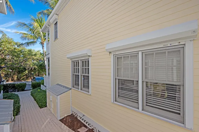 a view of a patio with table and chairs and potted plants