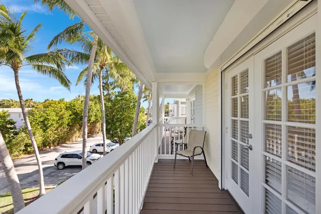 a front view of a house with a lake view
