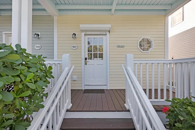 a view of a hallway with wooden floors