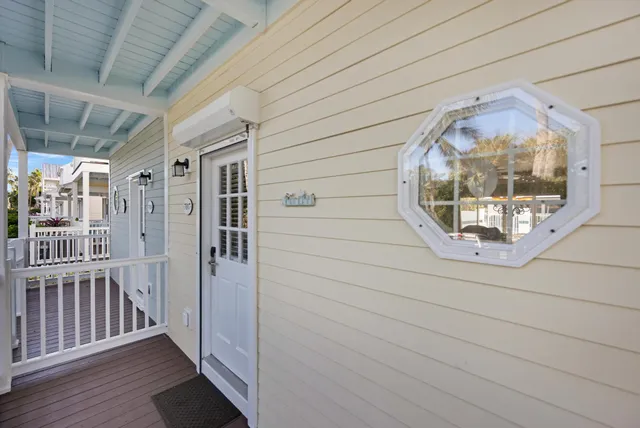 a view of a chairs and table in the balcony