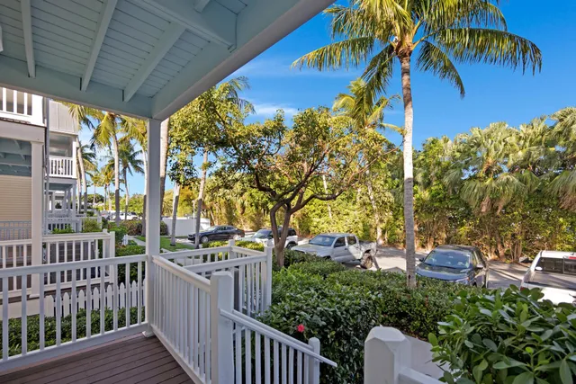 a kitchen with stainless steel appliances granite countertop a sink a refrigerator and a granite counter tops