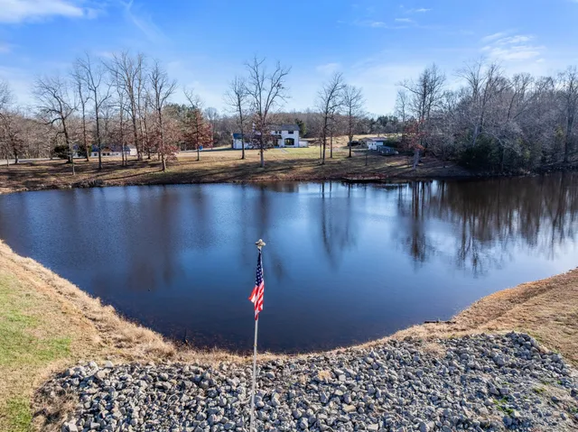 a view of a lake with a house