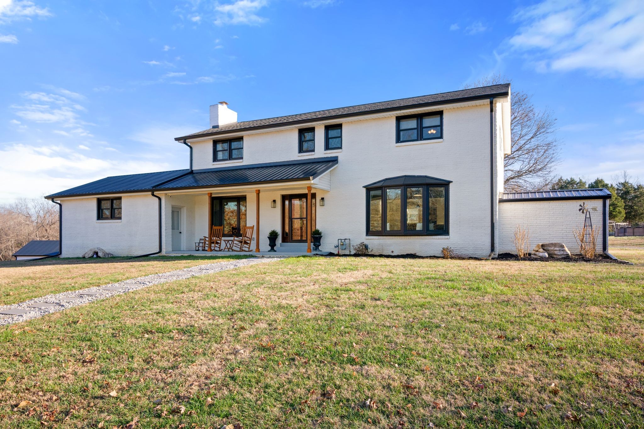 250 Pate Lane Dickson, TN 37055 - Photo 40 of 57 a front view of house with yard and trees in the background
