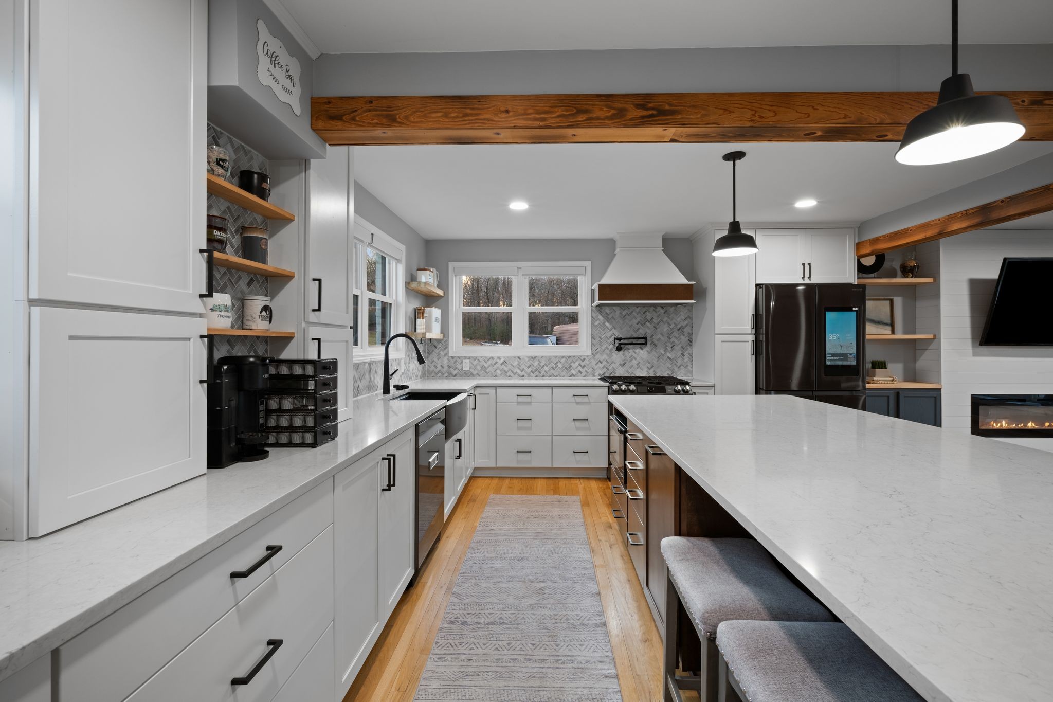 250 Pate Lane Dickson, TN 37055 - Photo 10 of 57 a large kitchen with stainless steel appliances granite countertop a large stove a sink dishwasher and white cabinets with wooden floor