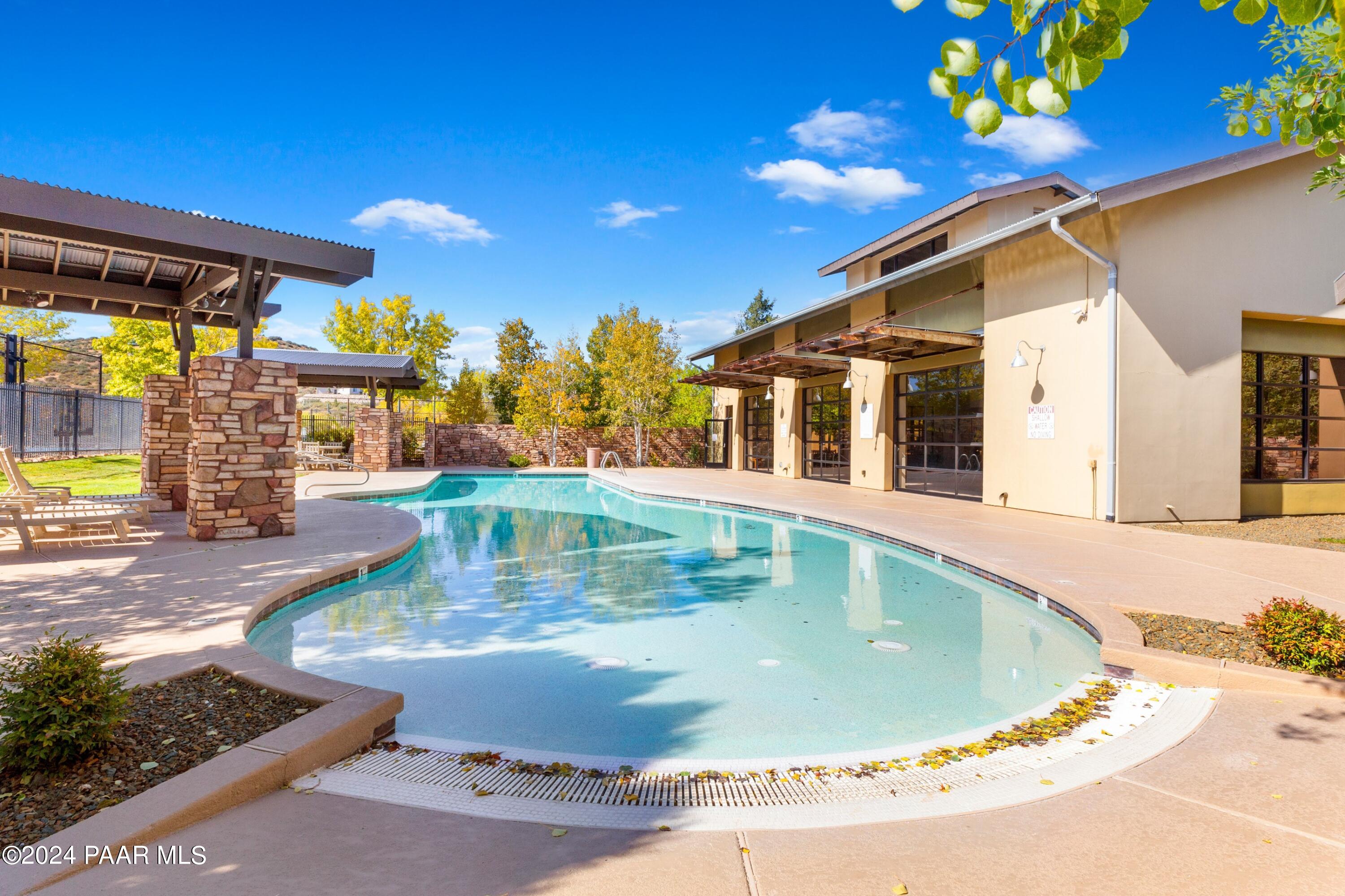 1195 Rigo Ranch Road Prescott Valley, AZ 86314 - Photo 35 of 65 a view of a house with swimming pool