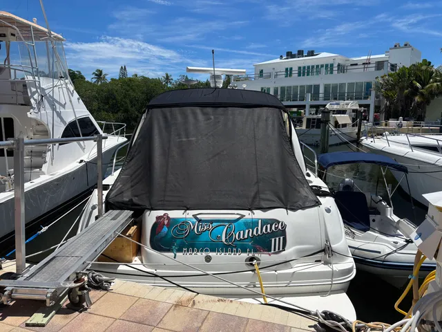 a view of a swimming pool with a table and chairs