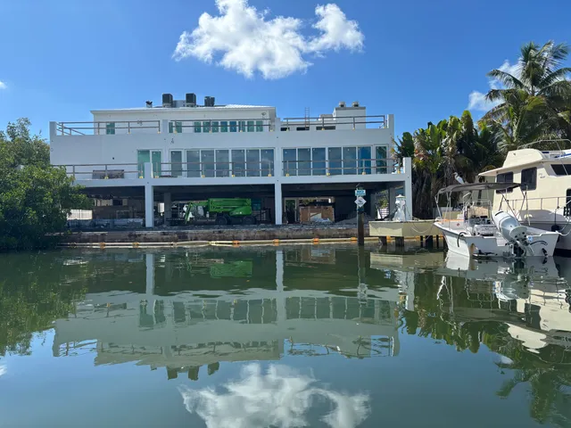 a view of a patio with table and chairs