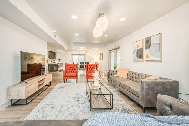 a living room with furniture and a flat screen tv