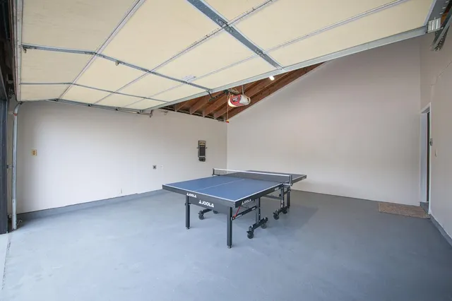 a room with a table and chairs