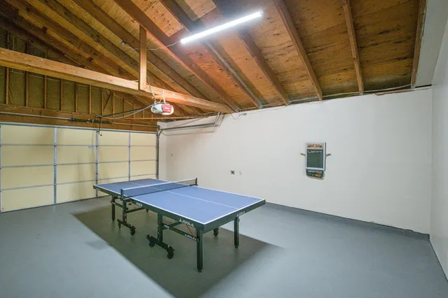 a view of a backyard with a table and chair
