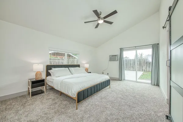 a bathroom with a double vanity sink toilet and shower