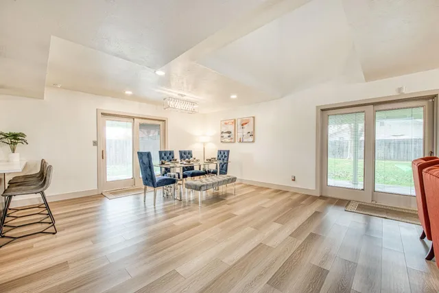 a view of a work space with furniture and wooden floor