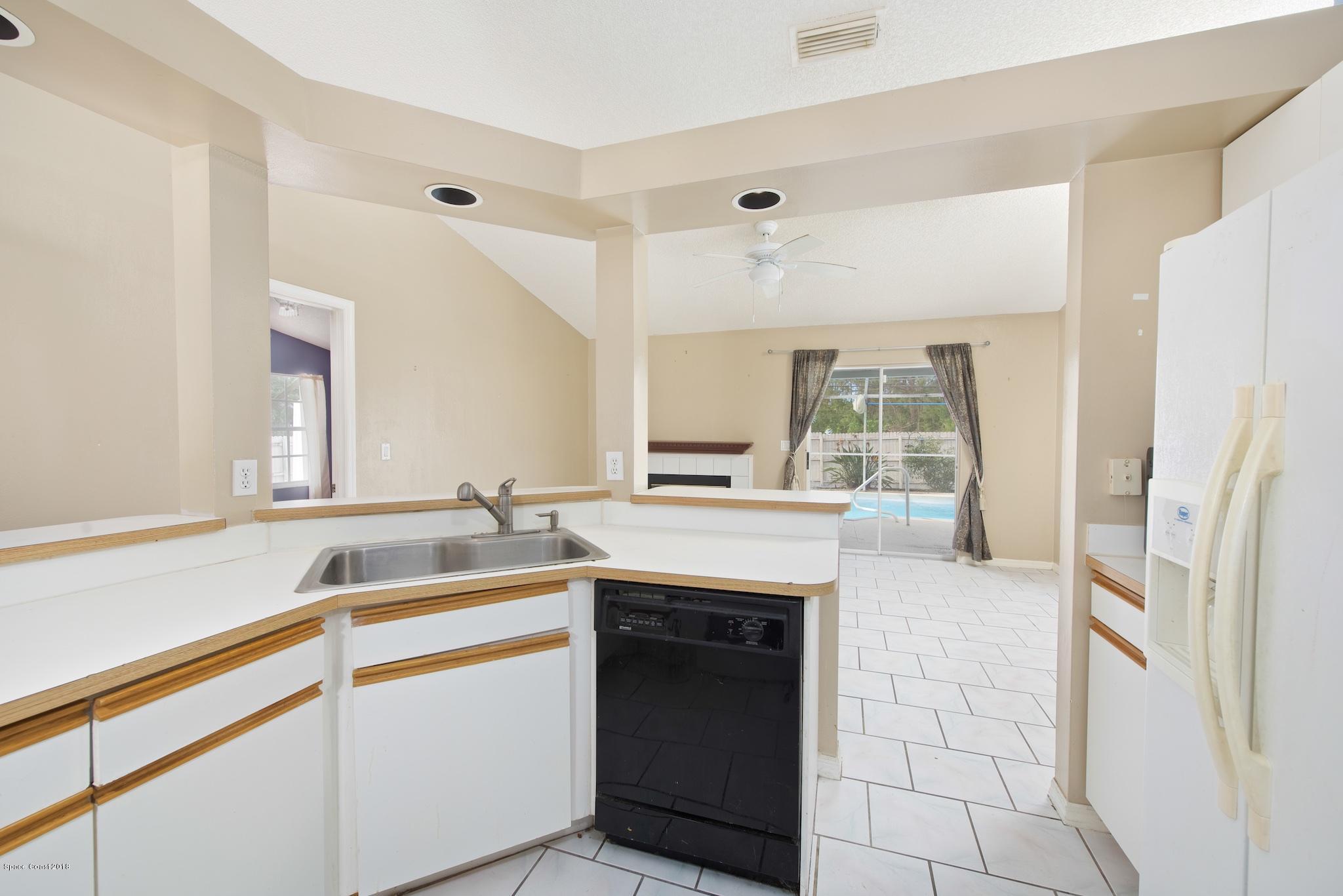 320 Wendover Road Southwest Palm Bay, FL 32908 - Photo 12 of 21 Kitchen to Family Room
