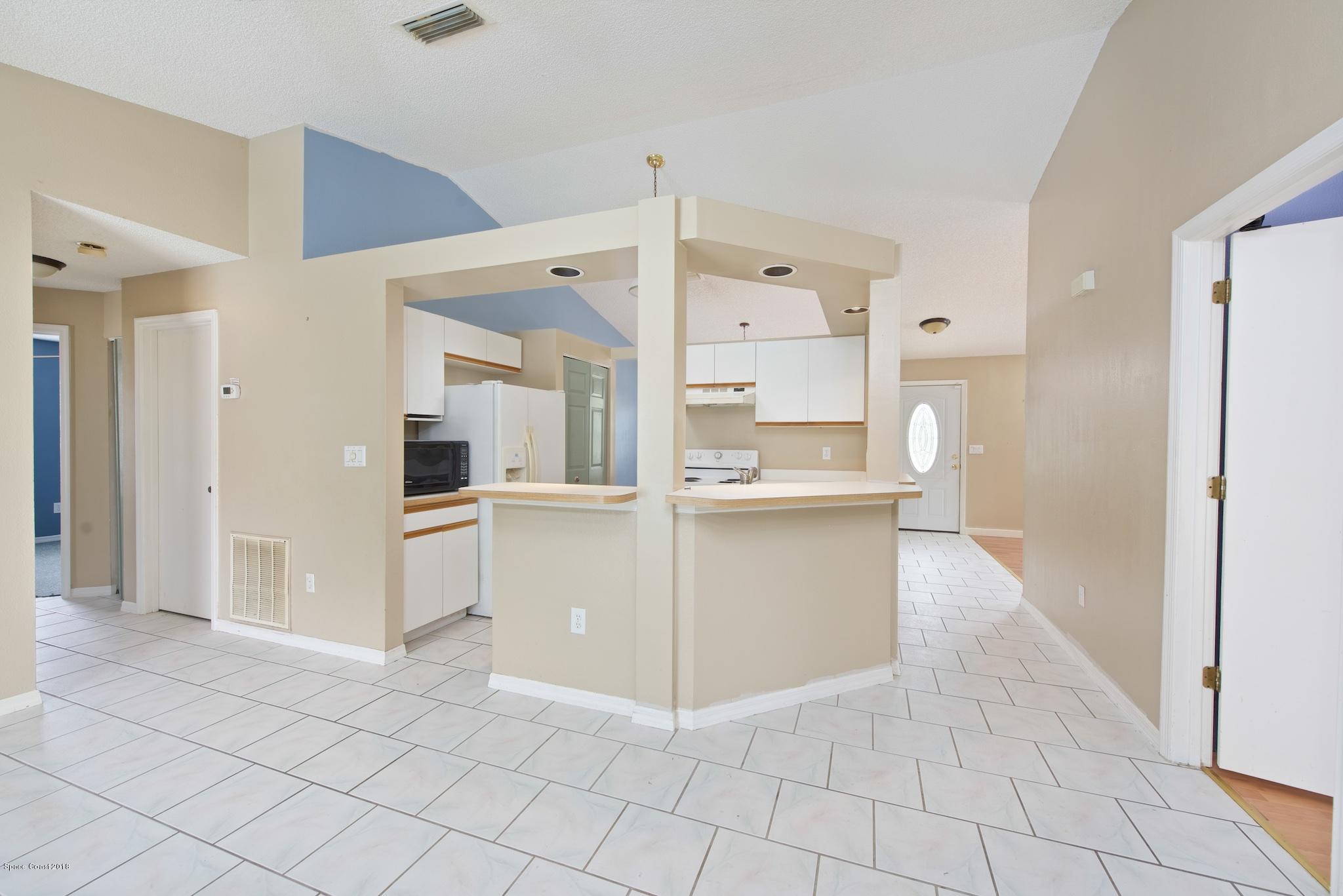 320 Wendover Road Southwest Palm Bay, FL 32908 - Photo 6 of 21 Family Room to Kitchen