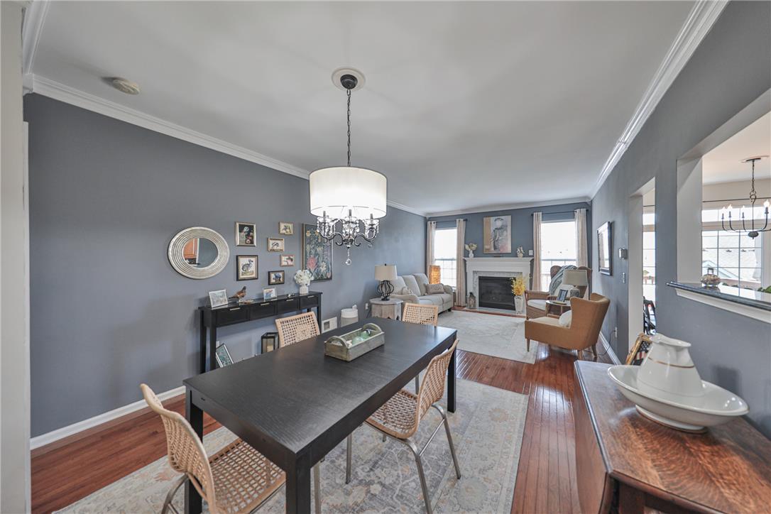 163 Muirfield Way Easton, PA 18042 - Photo 7 of 48 a view of a dining room with furniture wooden floor and chandelier