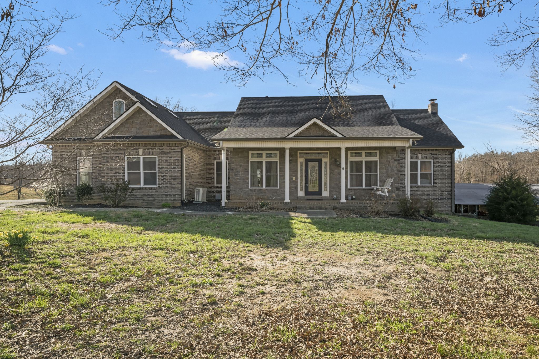 a front view of a house with a yard