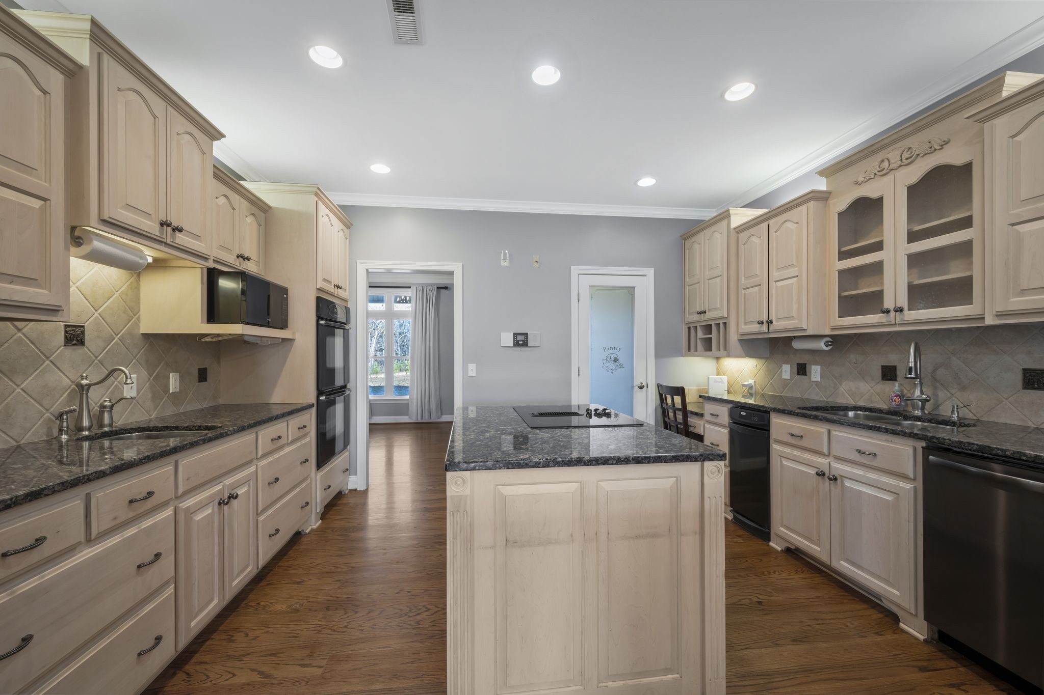 1053 Hall Cemetery Road Burns, TN 37029 - Photo 11 of 64 a large kitchen with stainless steel appliances lots of counter space and a sink