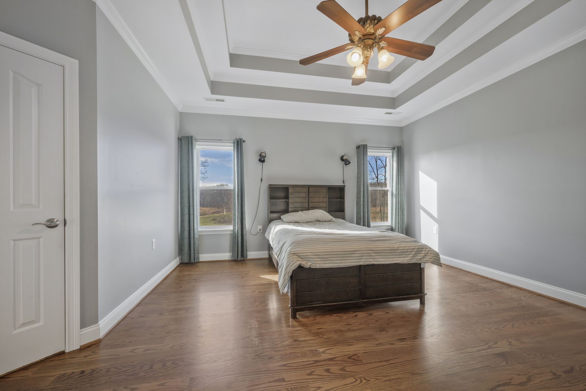 1053 Hall Cemetery Road Burns, TN 37029 - Photo 22 of 64 a bedroom with a bed and a chandelier