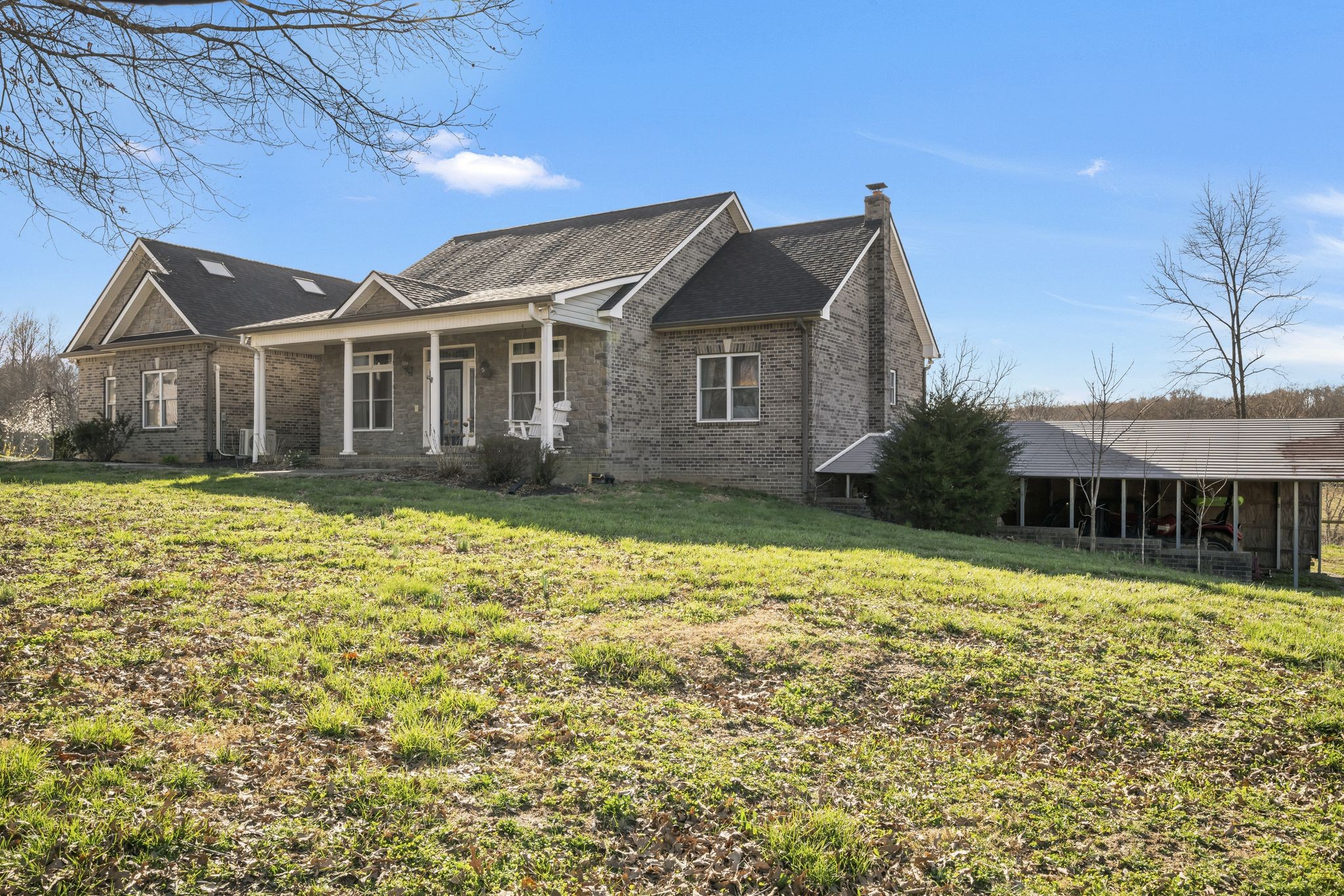 1053 Hall Cemetery Road Burns, TN 37029 - Photo 3 of 64 a front view of a house with a yard