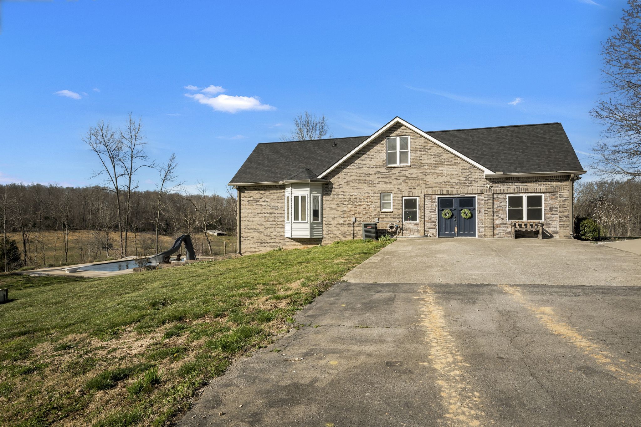 1053 Hall Cemetery Road Burns, TN 37029 - Photo 32 of 64 a front view of a house with a yard
