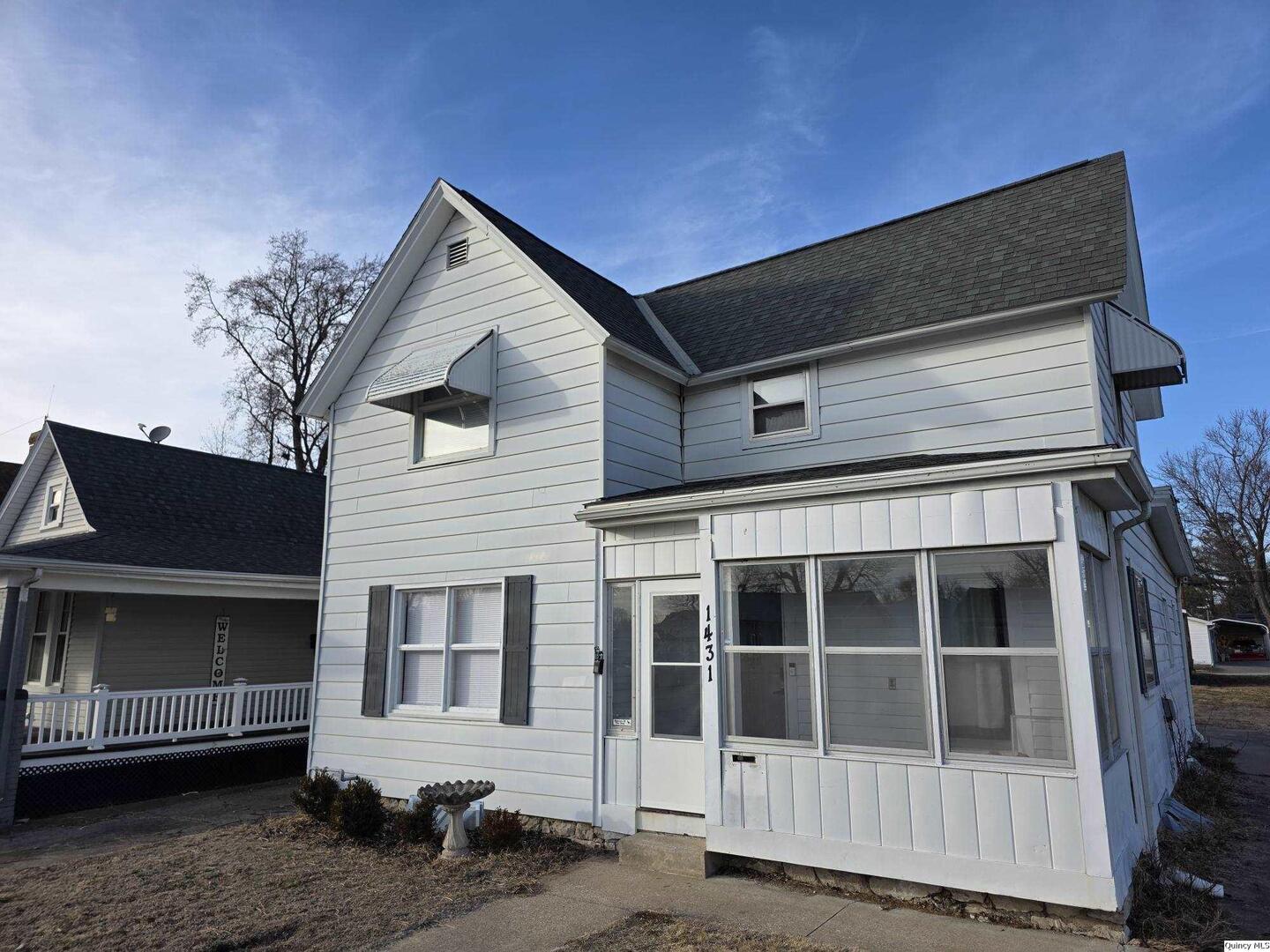 1431 Spruce Street Quincy, IL 62301 - Photo 2 of 36 a view of a house with a yard