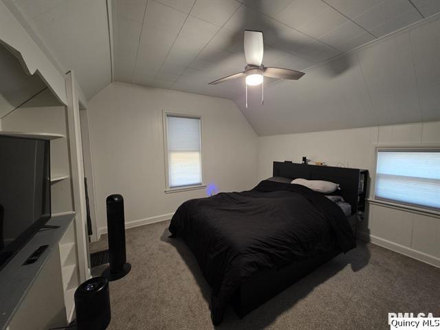 1431 Spruce Street Quincy, IL 62301 - Photo 22 of 36 a bedroom with a bed and a flat tv screen on the dresser