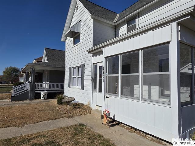 1431 Spruce Street Quincy, IL 62301 - Photo 28 of 36 a front view of a house with a yard