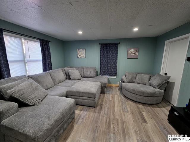 1431 Spruce Street Quincy, IL 62301 - Photo 5 of 36 a living room with furniture and a flat screen tv