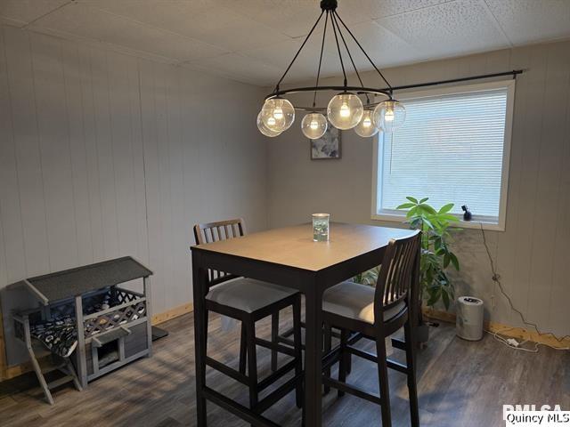 1431 Spruce Street Quincy, IL 62301 - Photo 6 of 36 a view of a dining room with furniture wooden floor and chandelier