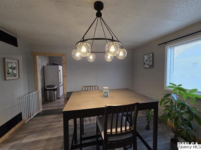 1431 Spruce Street Quincy, IL 62301 - Photo 7 of 36 a view of a dining room with furniture and wooden floor