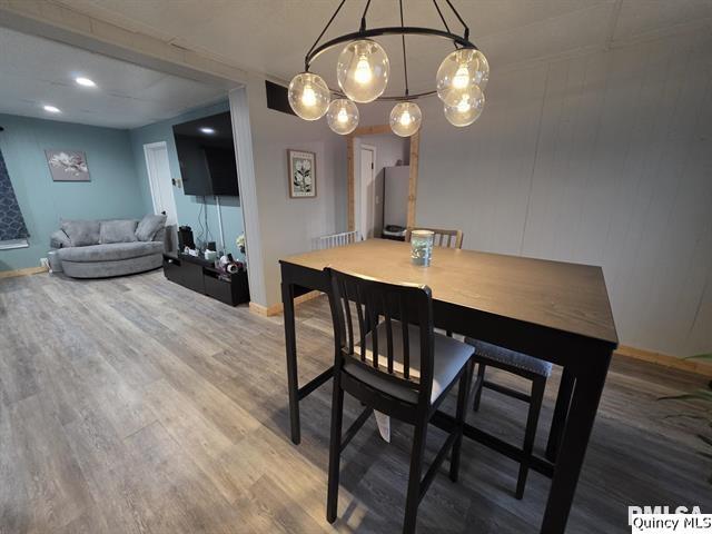 1431 Spruce Street Quincy, IL 62301 - Photo 8 of 36 a view of a dining room with furniture and wooden floor