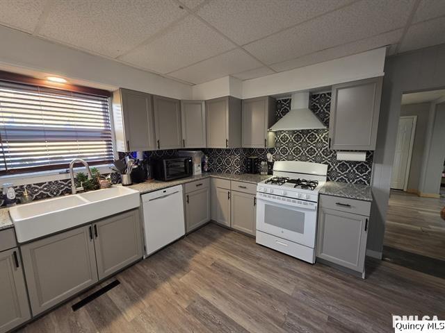 1431 Spruce Street Quincy, IL 62301 - Photo 9 of 36 a kitchen with white cabinets and white appliances