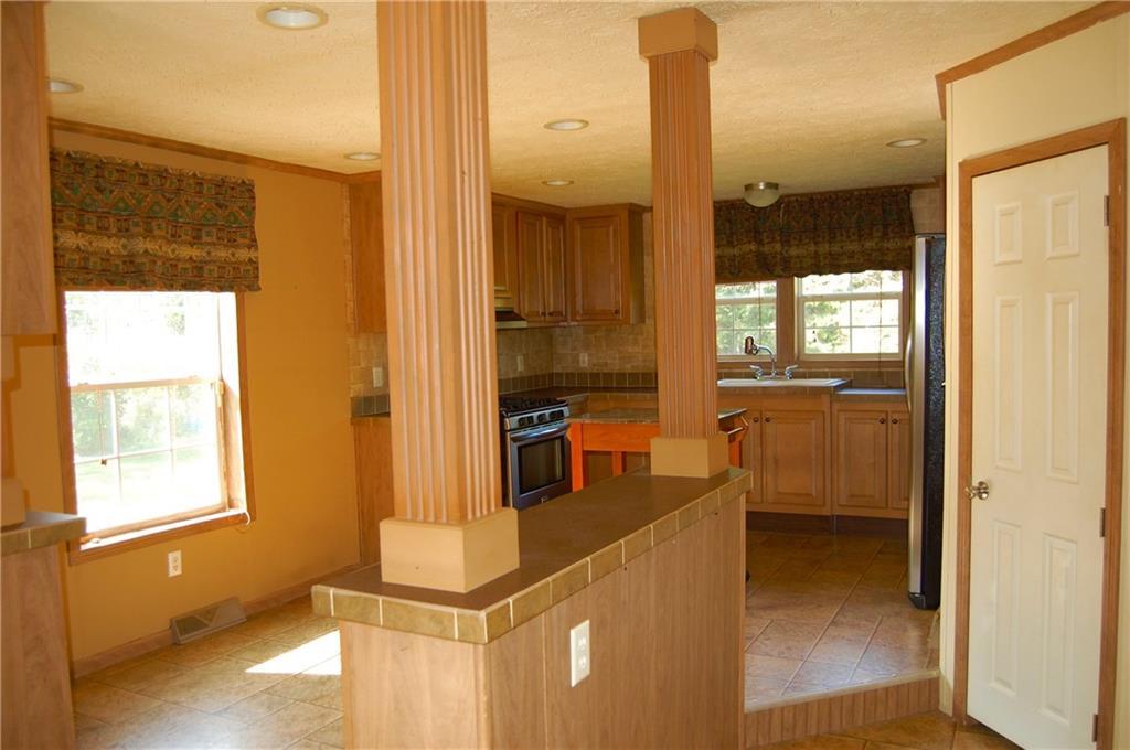 326 Fuller Corner Road Hartland, ME 04943 - Photo 6 of 35 The kitchen flows into the family room.
