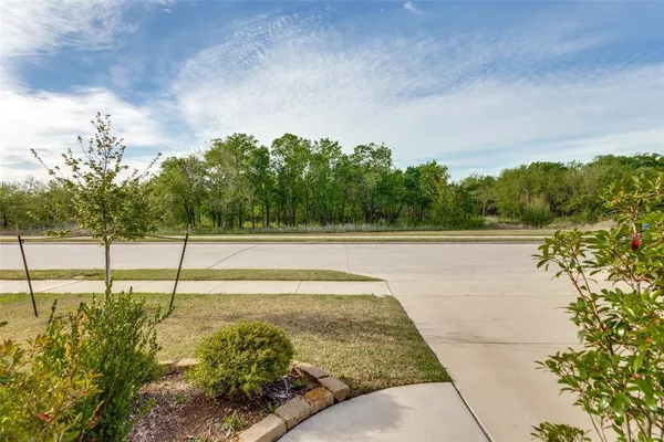 a view of a swimming pool with a yard