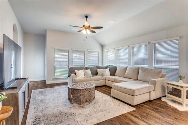a living room with furniture and a large window