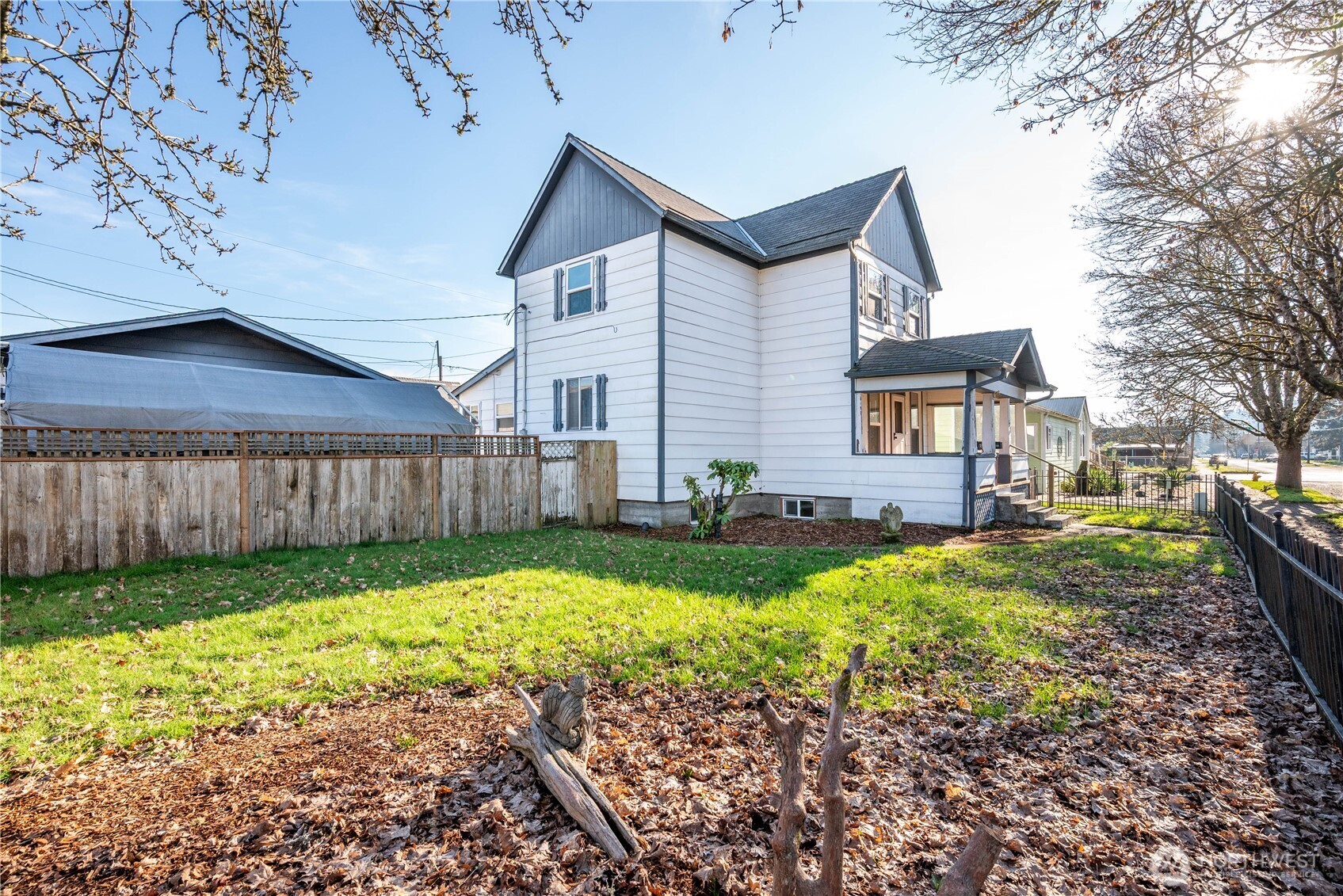 136 3rd Avenue Southwest Castle Rock, WA 98611 - Photo 27 of 40 a view of a house with backyard and sitting area