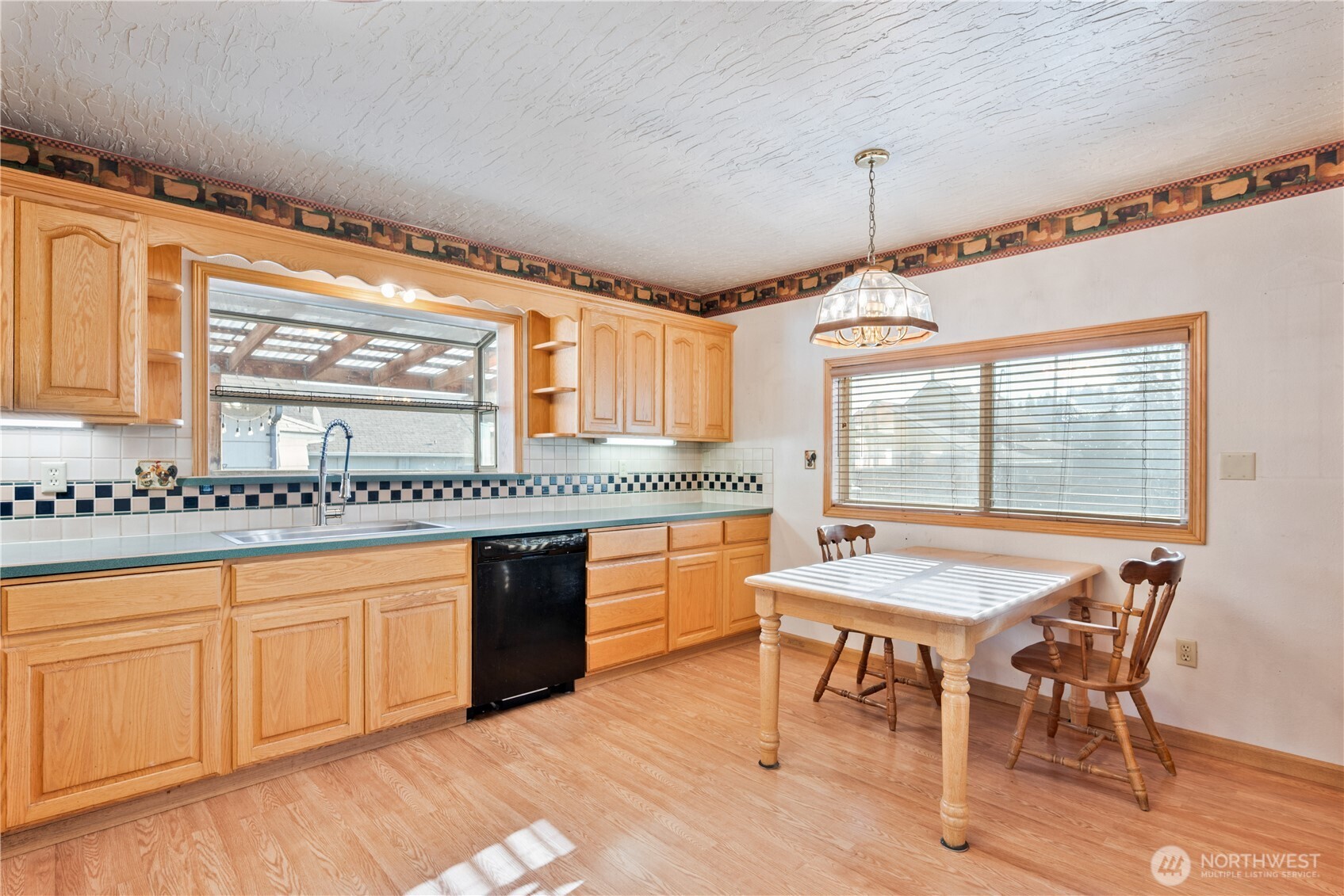 136 3rd Avenue Southwest Castle Rock, WA 98611 - Photo 6 of 40 a large kitchen with a table and chairs in it