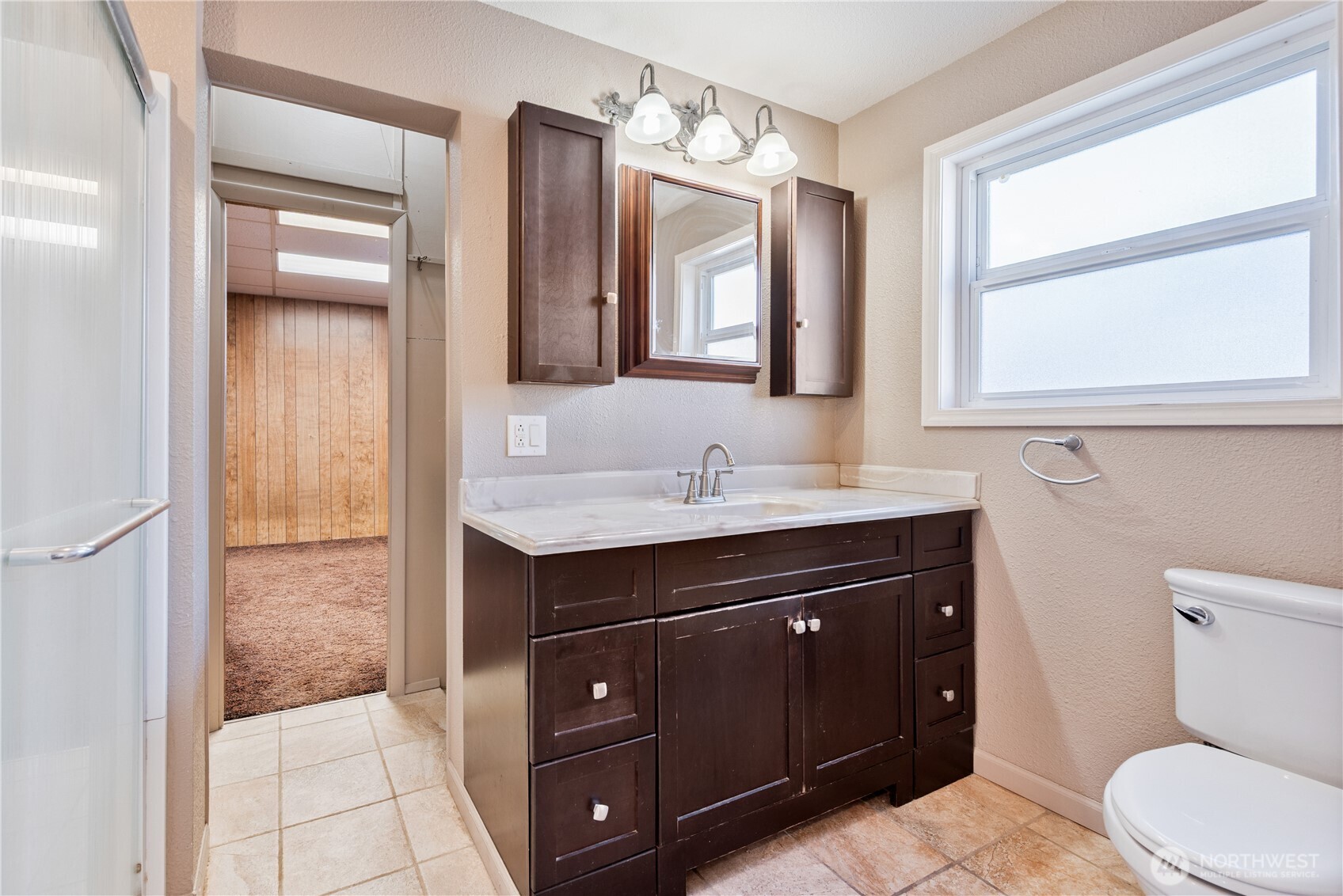 136 3rd Avenue Southwest Castle Rock, WA 98611 - Photo 9 of 40 a bathroom with a sink vanity toilet and a mirror