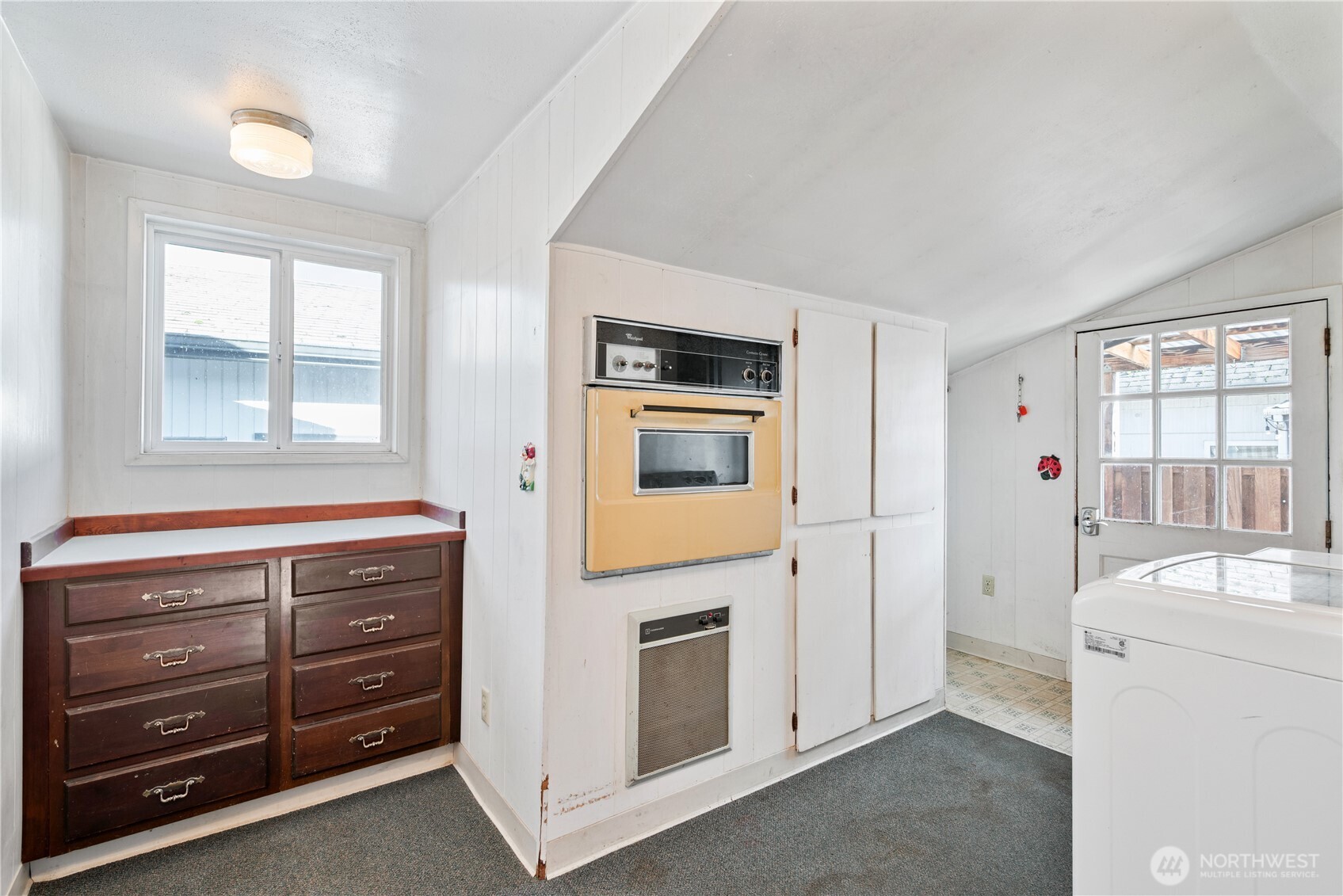 136 3rd Avenue Southwest Castle Rock, WA 98611 - Photo 10 of 40 a room with a dresser and a window