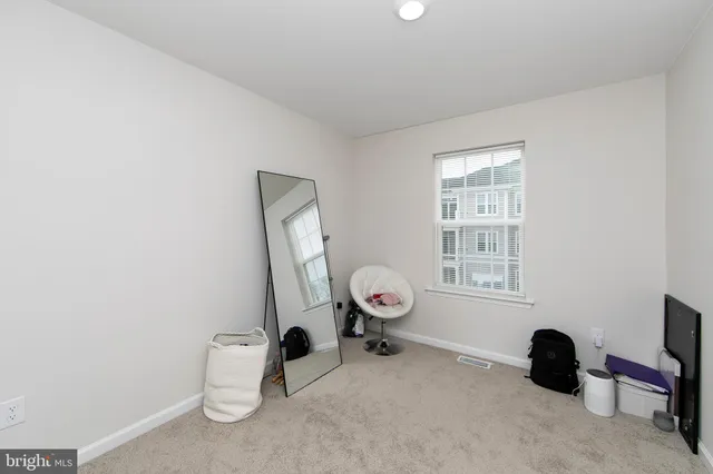 a room with a couch and a window