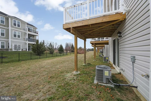 a view of a swimming pool with a yard